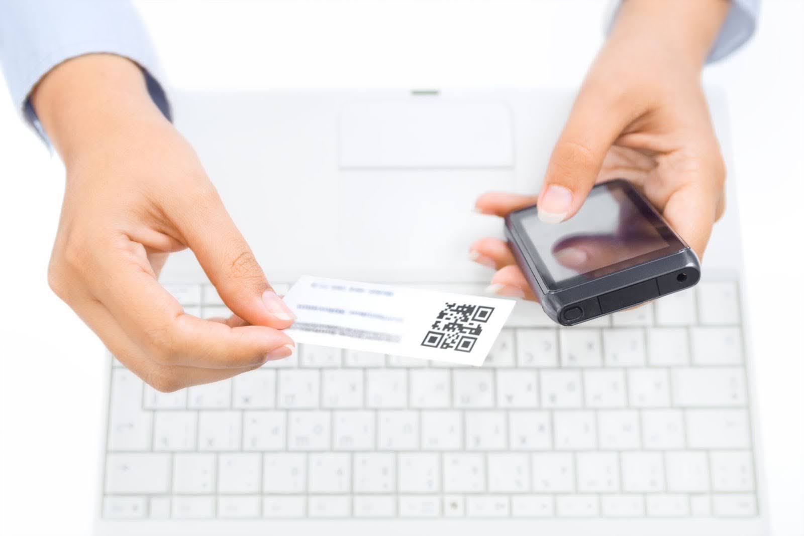 a person is scanning a qr code on a business card