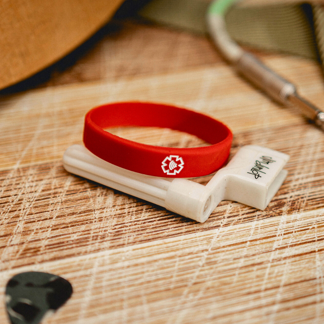 Red NFC Medical Band laying on a desk