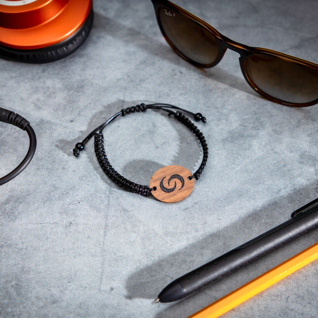 NFC Bracelet next to glasses